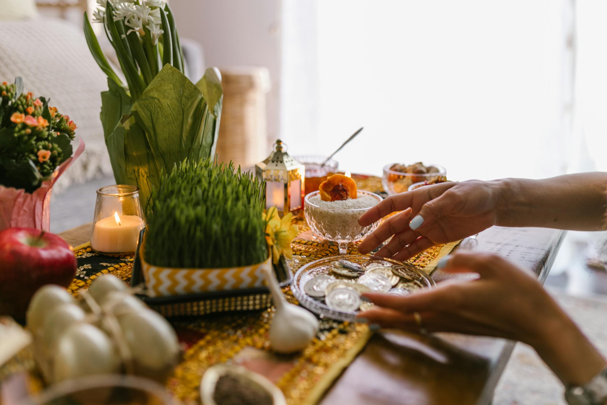 Celebrate Nowruz with a colorful Haft Seen table featuring symbolic items for Persian New Year.